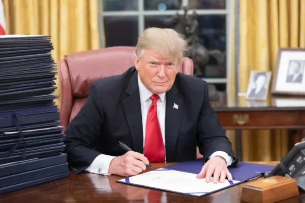 Donald Trump signing executive orders.